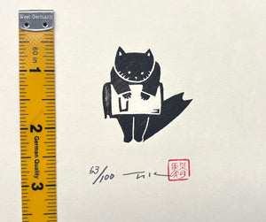 - Cat Carrying a Large Book -