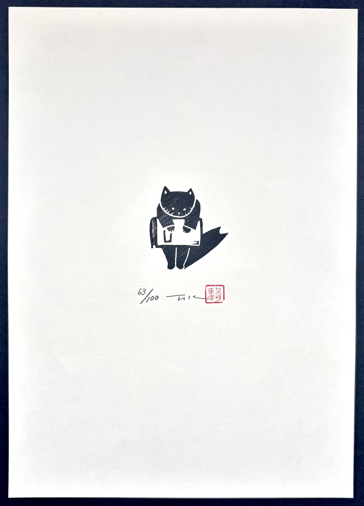 - Cat Carrying a Large Book -